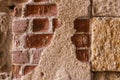 Stucco falling off of weathered bricks Royalty Free Stock Photo