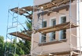 Stucco, Painting and Plastering Exterior House Scaffolding Facade Wall.