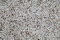 Stucco texture with small stones, pebbles on the wall. Royalty Free Stock Photo