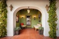 stucco walls with ivy, arched entryway