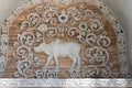 Stucco of a zodizac cow, classical Thai style on a temple wall Royalty Free Stock Photo