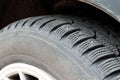 Studded car tire, snow tire. Car tire with spikes. Winter tire. Old automobile tire Royalty Free Stock Photo