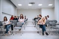 Student activities at a summer campsite, young people listen to a lecture on ecology while in the college auditorium