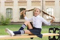 Student adorable child in formal uniform relaxing outdoors. Pleasant minutes of rest. Time to relax and have fun Royalty Free Stock Photo
