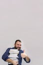 Student adult beard man with stack of book