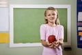 Student with apple for teacher