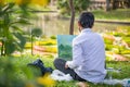 Student of arts painting in the Saranrom Park the Victoria lillies - a genus of water-plants, giant water lilly. Thailand, Bangkok Royalty Free Stock Photo