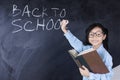 Student with back to school word on board Royalty Free Stock Photo