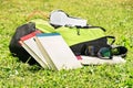 Student backpack with glasses, books and headphones