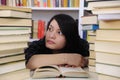 Student with books in a library Royalty Free Stock Photo