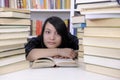 Student with books in a library