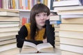 Student with books in a library Royalty Free Stock Photo