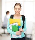 Student with books and schoolbag Royalty Free Stock Photo