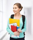Student with books and schoolbag Royalty Free Stock Photo