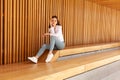 A student during a break between classes. A tired girl sits on a bench. A.businesswoman has a headache from work Royalty Free Stock Photo