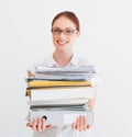 Time to hit the books. A student carrying a pile of files and books. Royalty Free Stock Photo