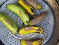 steamed or boiled bananas on a metal strainer. Royalty Free Stock Photo
