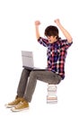 Student cheering with laptop Royalty Free Stock Photo