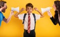 Student Child covers his ears because he does not want to hear reproach of the parents. Yellow background Royalty Free Stock Photo