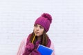 Student Copy Space Pondering Attractive Girl In Pink Hat Holding Folder Pencil Royalty Free Stock Photo