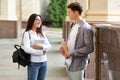 Student couple having break after classes and flirting Royalty Free Stock Photo