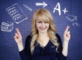 Student crossing her fingers, hoping for best, good grades in school Royalty Free Stock Photo