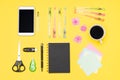 Student desk flat lay. Top view of working space table with morning coffee, smartphone and stationery, office supplies. Royalty Free Stock Photo