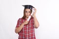 Student with diploma and graduation cap Royalty Free Stock Photo