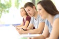 Student distracted with a phone during a class