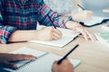 Student doing homework in library. Royalty Free Stock Photo