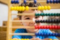 Student doing maths on abacus Royalty Free Stock Photo