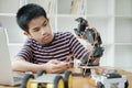 Student doing robot project in science technology of robotics programing and STEM education concept. Royalty Free Stock Photo