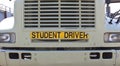 STUDENT DRIVER sign on front of truck