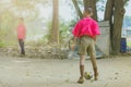 Student enjoy to play the old football with his friends on the ground Royalty Free Stock Photo