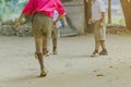 Student enjoy to play the old football with his friends on the ground Royalty Free Stock Photo