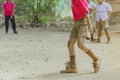 Student enjoy to play the old football with his friends on the ground Royalty Free Stock Photo