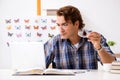 The student entomologist studying new species of butterflies