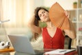 Student fanning at home suffering heat stroke Royalty Free Stock Photo