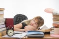 Student fell asleep at table getting ready to pass the graduation project