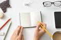 Student female hands holding a pencil and open notebook Royalty Free Stock Photo