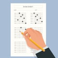 The student filling out answers to exam test answer sheet with a pencil. School and Education. Test score sheet with Royalty Free Stock Photo