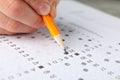 Student fills answers test sheet