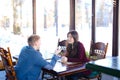 Student on first date with new boyfriend in cafe