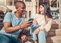 Student, friends and phone in social media at campus for news, entertainment or connectivity in the outdoors. Man and Royalty Free Stock Photo