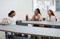 Student friends and talk in university cafeteria for course guidance and thoughts in break. Young and diverse women in Royalty Free Stock Photo