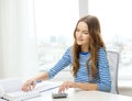 Student girl with book, calculator and notebook Royalty Free Stock Photo