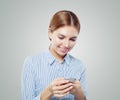 Student girl cell phone. Young woman texting Royalty Free Stock Photo