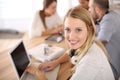 Student girl in class working on laptop Royalty Free Stock Photo