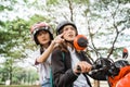 Student girl confused while looking for address while riding motorbike