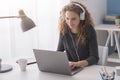 Student girl connecting with her laptop and chatting